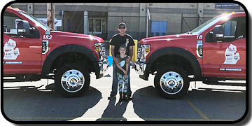 A-1 Towing and Recovery - Chad Momber with Child - Newaygo, MI
