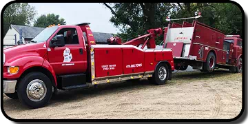 A-1 Towing and Recovery - Flatbed Side View with Building - Newaygo, MI